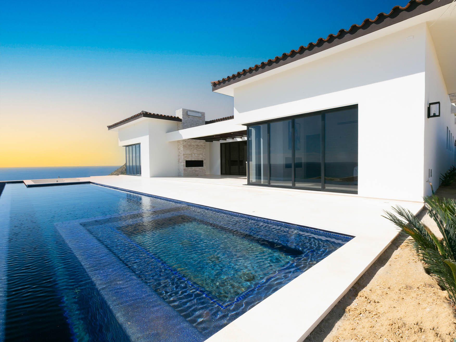 Quivira Copala Lot 40 is a stunning two-story residence featuring dual primary suites on the upper level, offering expansive Pacific Ocean for sale